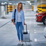 adult-woman-tourist-underground-airport-parking-lot