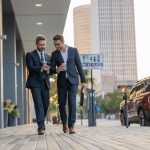 businessmen-walk-with-phone-street-copy-space-businessmen-walk-with-phone-outdoor