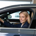 confident-blonde-woman-sitting-car-looking-determined
