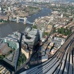 high-angle-view-illuminated-cityscape-by-river-city