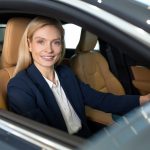 longhaired-blonde-business-woman-steering-wheel-car (3)