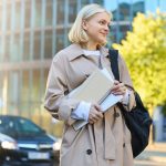young-woman-using-mobile-phone-while-standing-city